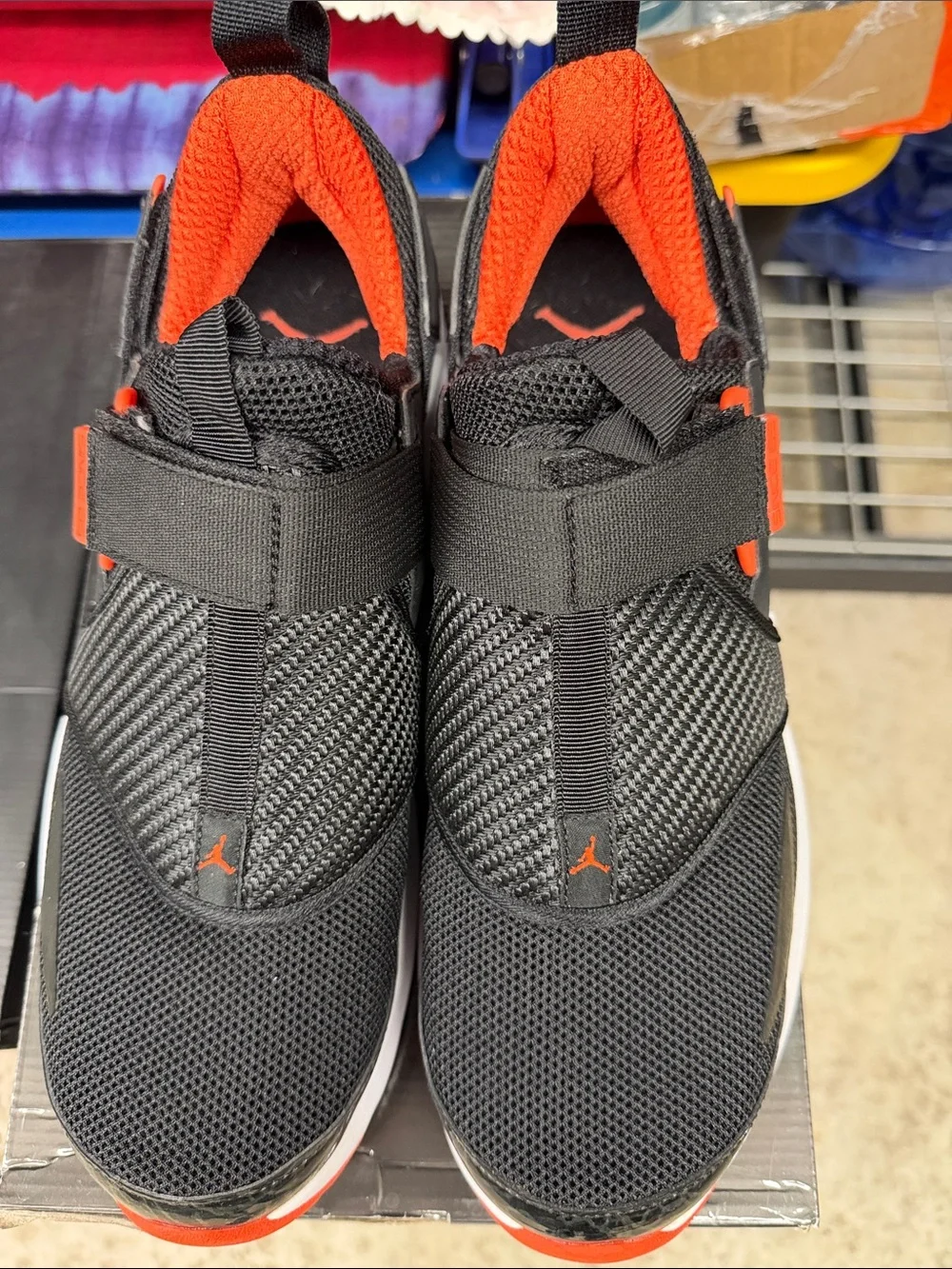 Jordan Black and Orange Strap Sneakers